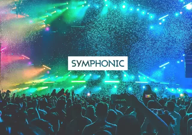 Una multitud en un concierto con luces de escenario coloridas y confeti; la palabra "SYMPHONIC" aparece escrita en negritas en el centro.