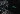Un portátil con el logo de Spotify en la pantalla se encuentra sobre una superficie oscura, rodeado de patrones de luz moteada que le dan un toque atmosférico.